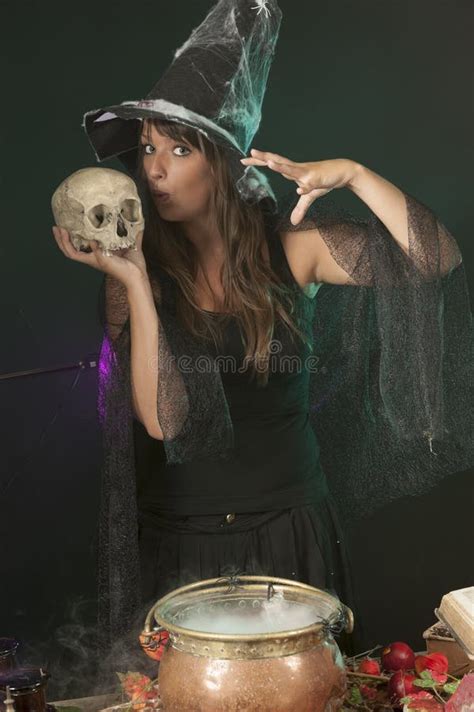 Halloween Witch Cooking A Potion In A Cauldron Stock Photo Image Of