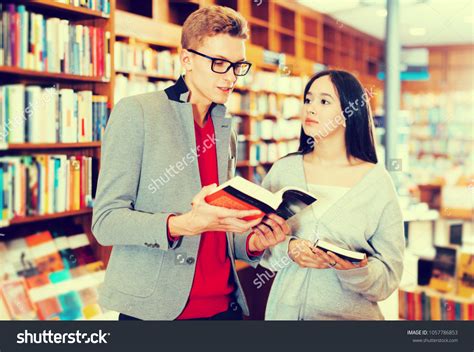 Handsome Students Studying Library Reading Discussing Stock Photo