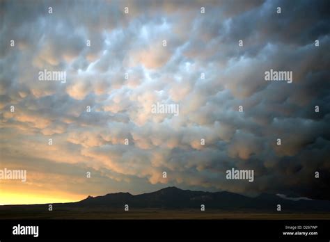 Inspiring sunset rolling clouds Stock Photo - Alamy