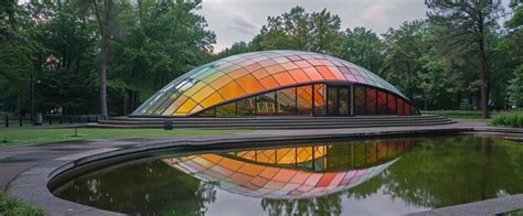 Premium Photo A House With A Rainbow Colored Glass Dome Sits In The Water