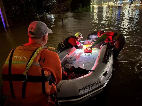 Four people missing as record rainfall causes widespread flooding in ...