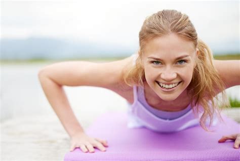 Premium Photo Push Yourself Shot Of A Young Woman Doing Yoga Outdoors