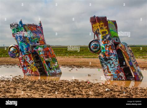 Cadillac Ranch Is An Art Installation Comprised Of Old Cadillacs Half