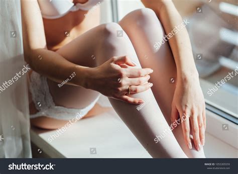 Sexy Lady White Lingerie Relaxing Window Stock Photo
