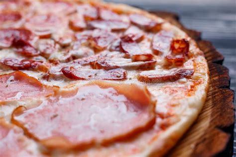 Hot Fresh Pizza With Bacon Salamiham And Pepperoni Close Up Stock