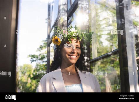 Portrait Of Smiling Woman Wearing Flower Tiara During Swedish Midsummer