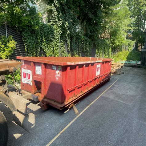 Yard Dumpster Rental In Lowell For An Office Carpet Removal And