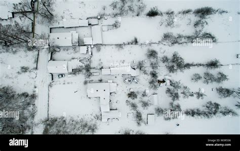 European village from a height. Winter cold picture of the roofs of ...