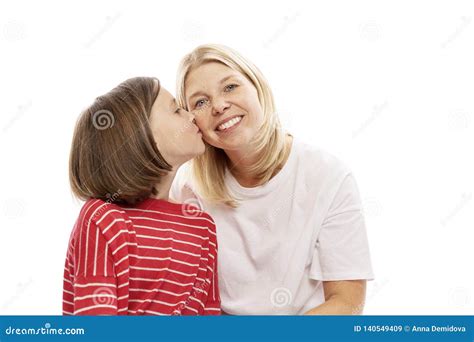 Mum With A Teenager Daughter Laughing And Hugging Isolated On White