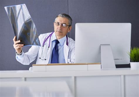 Premium Photo Close Up Of Male Doctor Holding Xray Or Roentgen Image