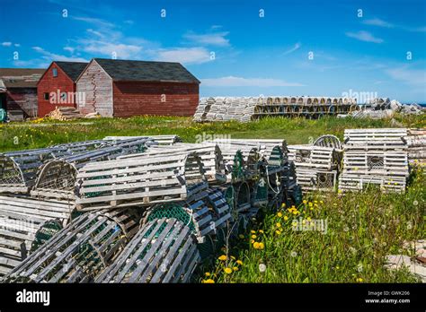 Salt Box Homes And Colorful Fishing Stages With Lobster Traps In The