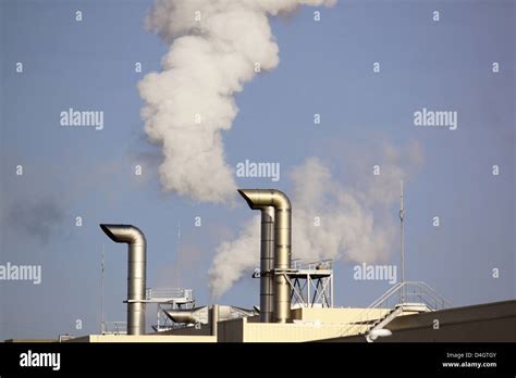 Polluting Smoke Leaving The Chimney Of A Factory For A Productive