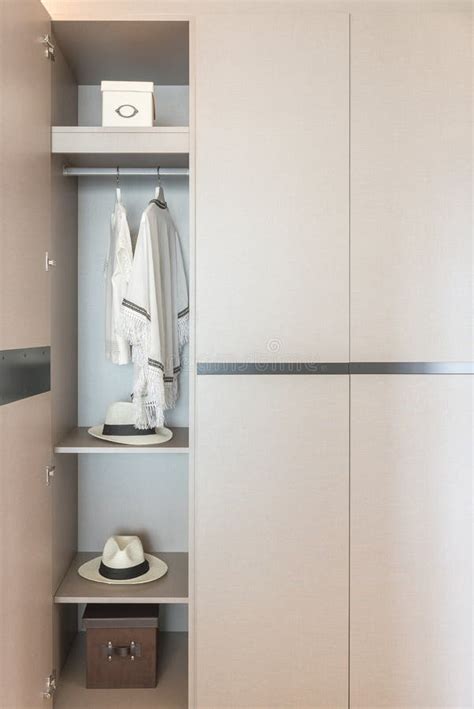 White Shirts Hanging on Rail in Wooden Wardrobe Stock Image - Image of ...