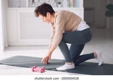 Athletic Mature Woman Exercising Home Active Stock Photo