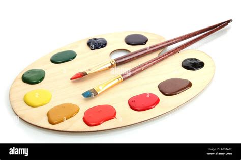 Wooden Art Palette With Paint And Brushesisolated On White Stock Photo