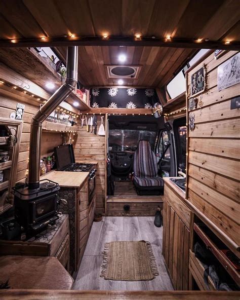 The Interior Of An Rv With Wood Paneling And Lights On It S Ceiling