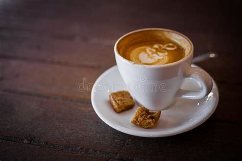 latte hot coffee  foam milk art   wooden table stock photo