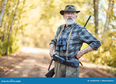 After Hunting Hunter Man Standing After Hunting In Forest Stock Photo