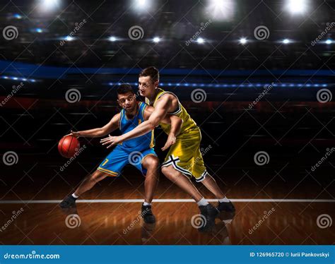 Two Basketball Players in Scrimmage during Basketball Match Stock Photo ...