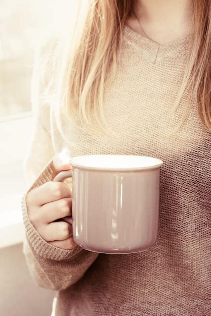 Premium Photo Female Hands Holding Hot Cup Of Coffee Or Tea In