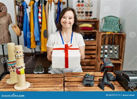 Brunette Woman With Down Syndrome Working As Shop Assistant Wrapping