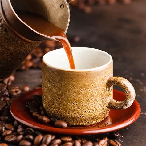 Premium Photo Close Up Coffee Pouring Into Cup