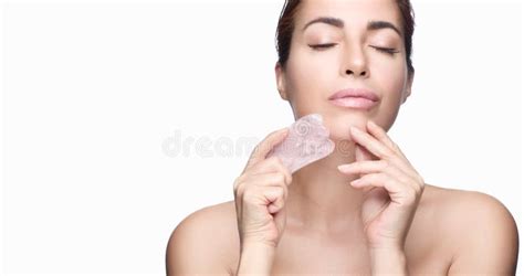 Beautiful Woman With Glowing Healthy Skin And Massage Gua Sha Tool