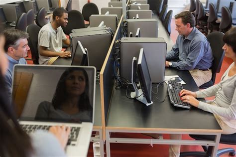 Premium Photo Teacher Standing In Front Of Computer Class