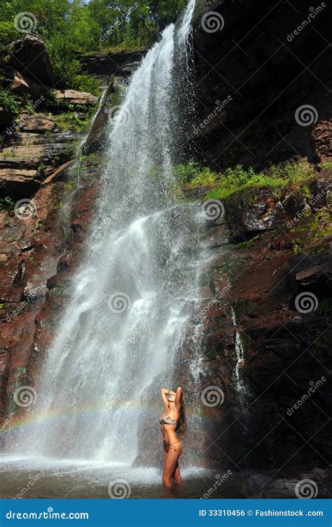 Beautiful Slim Fitness Model Posing Sexy Under Waterfalls Royalty Free