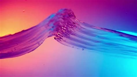 Water Splash In Slow Motion On Colorful Stock Video Pond5