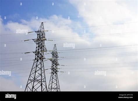 The Silhouette Of The Electricity Transmission Pylon In Daytime