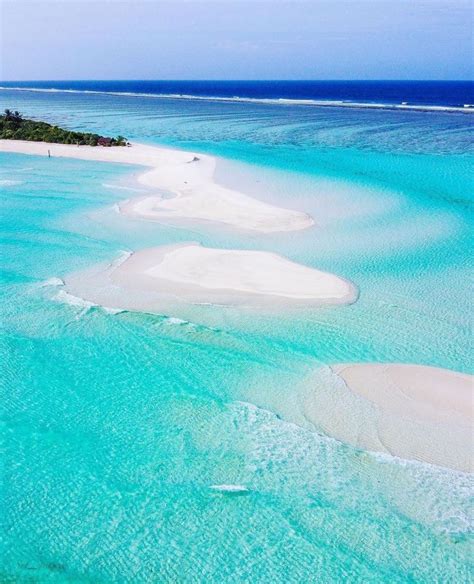 Small sand islets in the Maldives