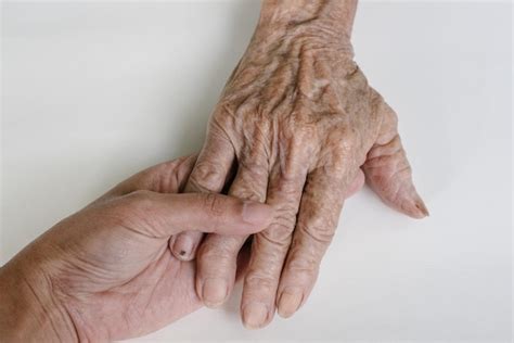 Premium Photo Cropped Image Of People Holding Hands On White Background