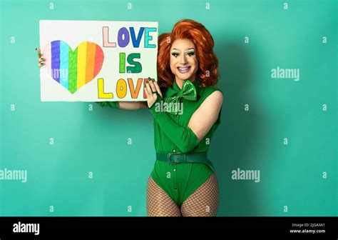 Happy Drag Queen Celebrating Gay Pride Holding Banner With Rainbow Flag