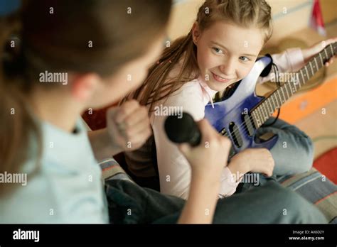 Two friends playing music Stock Photo - Alamy