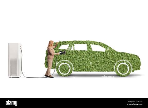 Woman Charging An Electric Vehicle Made Of Green Grass Isolated On