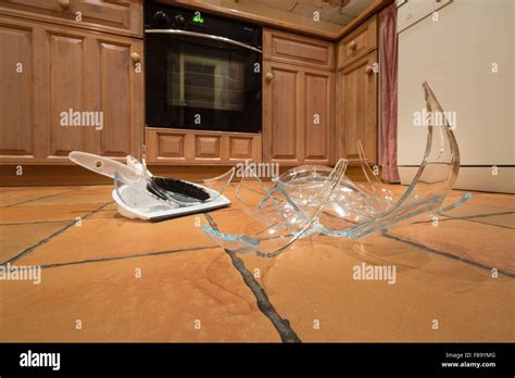 Remnants Pile Of Broken Glass On Floor After Accident And Pyrex Glass Bowl Slipped Out Of Wet