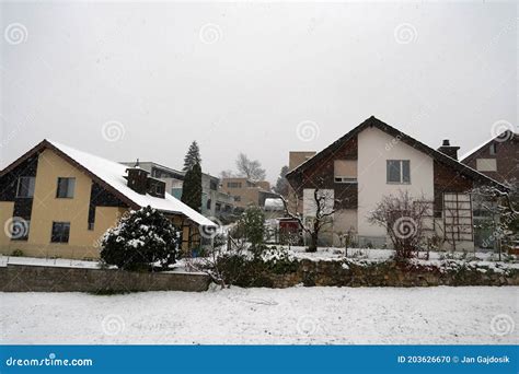 Residential District Of Swiss Village Urdorf In Winter Under Snow