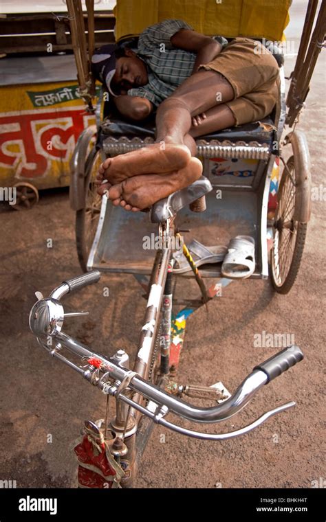 Indian Cycle Rickshaw Wala Taking Time Out In Puri India Stock Photo