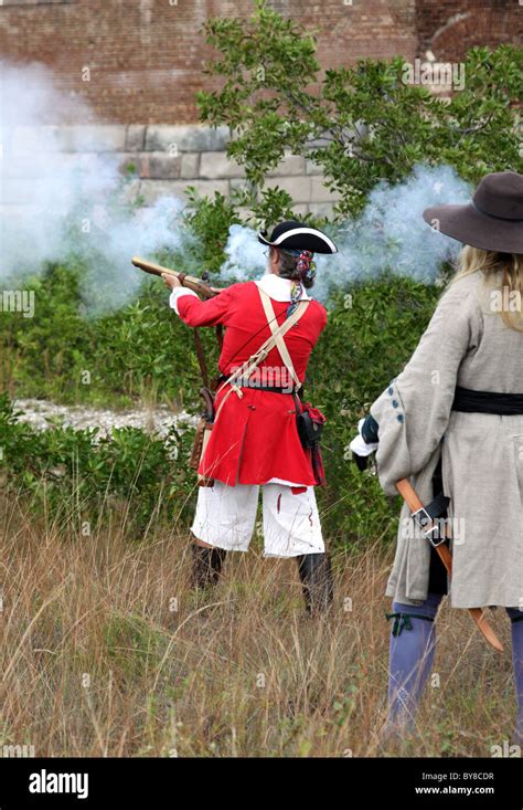 Man In 15th Century English Military Garb Firing A Blunderbuss Stock