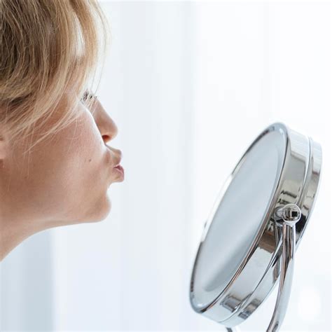 Free Photo Close Up Woman Blowing A Kiss In The Mirror