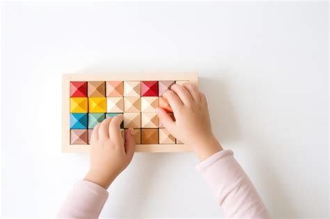 Premium Photo | Top view of child hand holding and playing with wooden ...