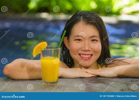 Young Beautiful And Happy Asian Korean Woman In Bikini Enjoying Summer