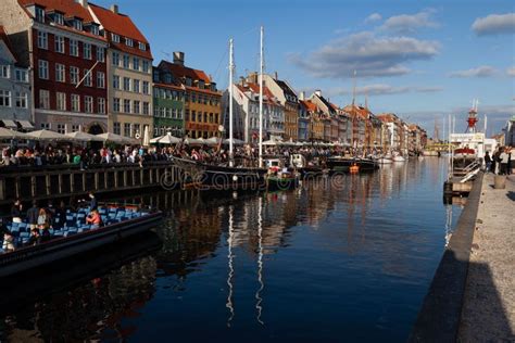 Beautiful Nyhavn Neighbourhood With Cafes On The Shore Of The Water In