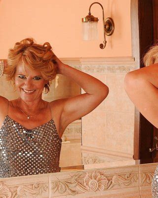 Naughty Granny On High Heels Stripping Off Her Dress And Spreading Her Legs Porn Pictures Xxx