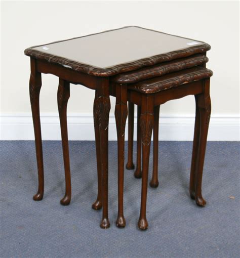 A 20th Century Reproduction Mahogany Nest Of Three Occasional Tables