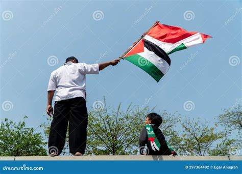 A Young Man Holding a Palestinian Flag Editorial Photography - Image of ...