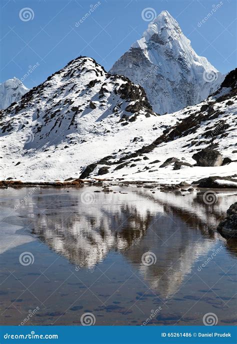 View Of Mount Ama Dablam Mirroring In Lake Everest Area Stock Photo