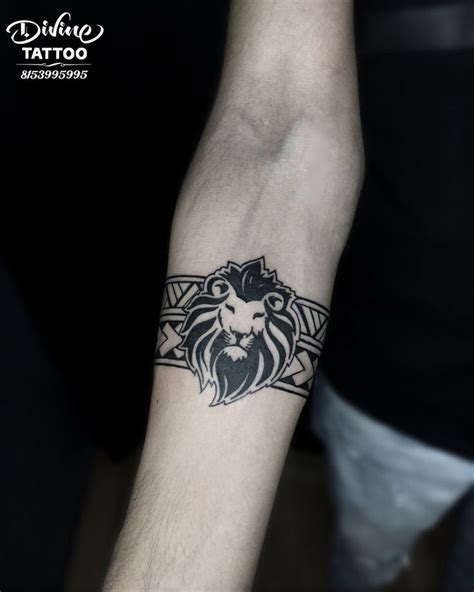 Lion armband tattoo | armband tattoo | divinetattoorajkot | Band tattoo ...