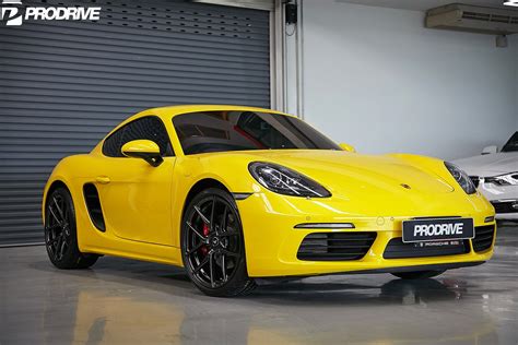 Hyper active Tuned Yellow Porsche Cayman — CARiD.com Gallery